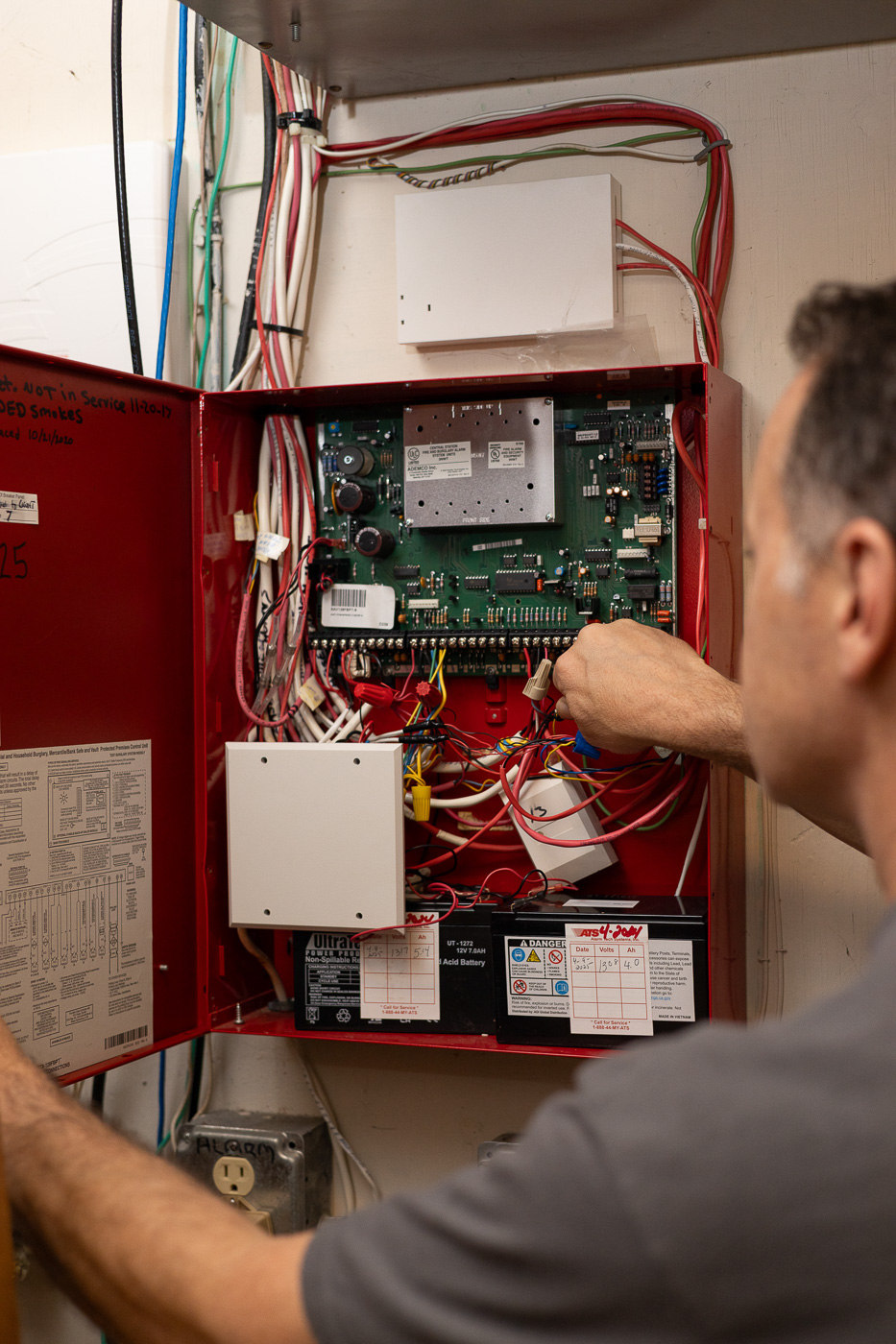 Ryan Keeler inspecting a breaker panel