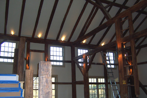 A room with beams and lights in it